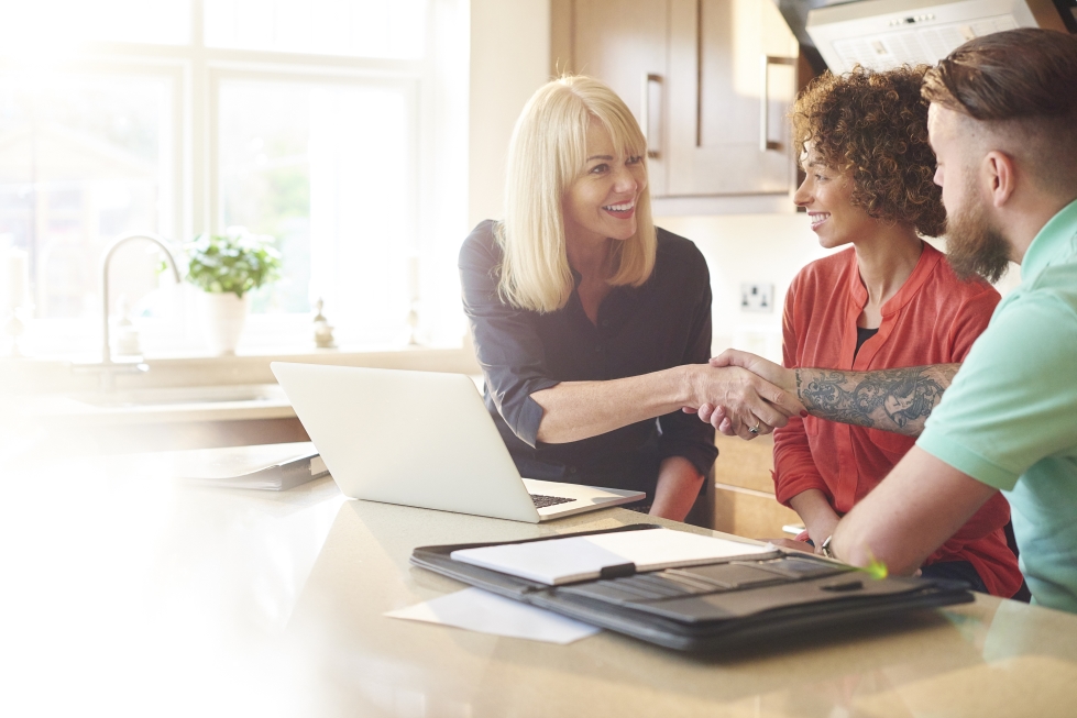 A couple meeting with their financial advisor